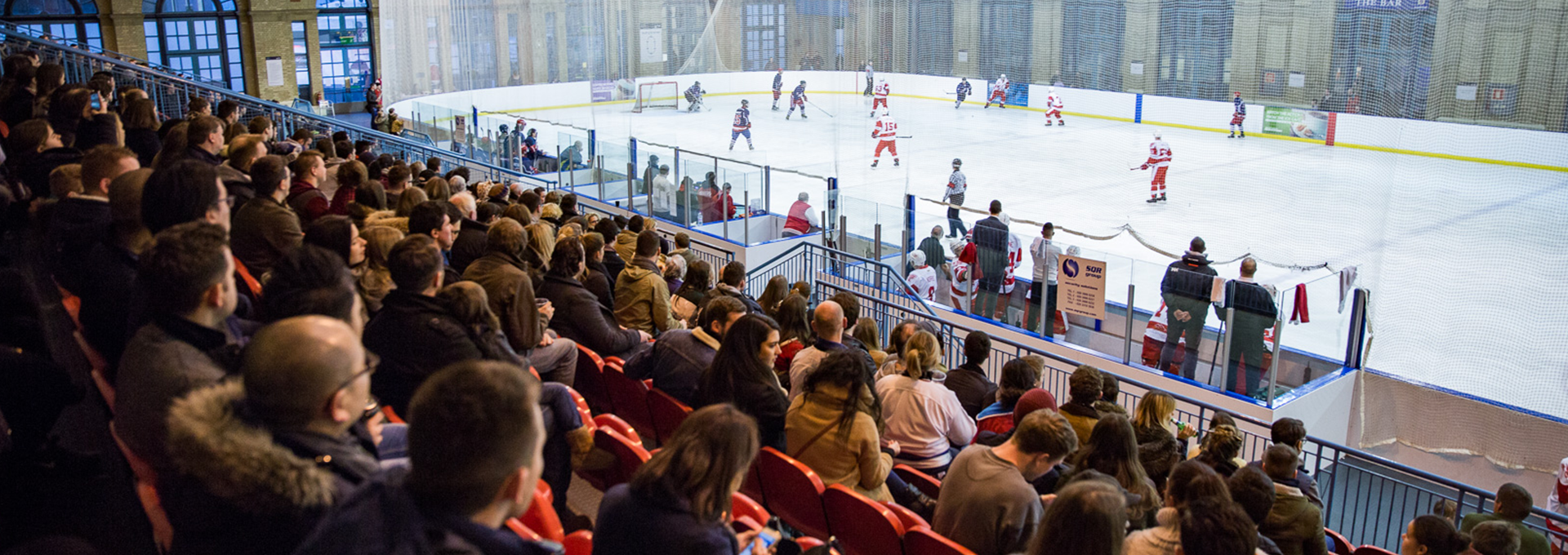 Spectators watching an ice hockey game